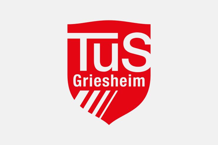 Logo des TuS Griesheim in rotem Wappen mit weißen Buchstaben und Linien.